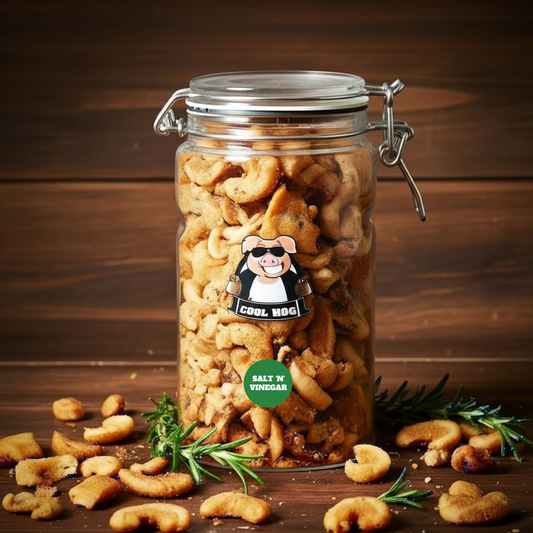Salt and vinegar flavored pork scratching jar from Cool Hog Snacks, showing crispy pork scratchings in a clear jar.