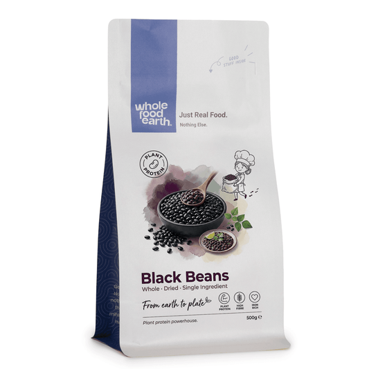 Cooked black beans from Whole Food Earth in a bowl, showcasing shiny black beans and fresh texture.