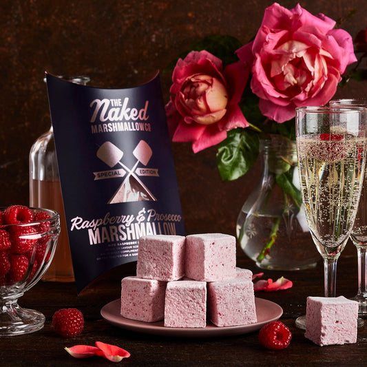 Assorted raspberry and prosecco flavored gourmet marshmallows from THE MARSHMALLOW FACTORY, showing soft, fluffy marshmallow treats.
