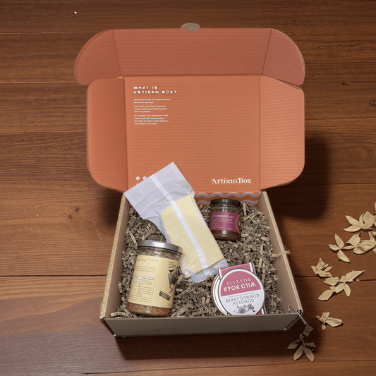 Gift box with food products on a wooden surface