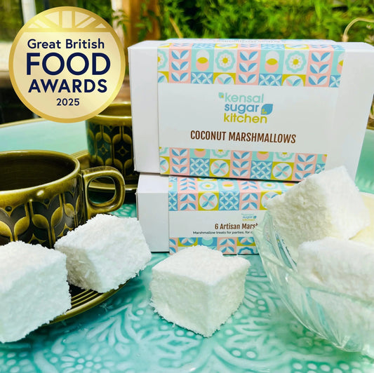 Kensal Sugar Kitchen coconut marshmallows with white, fluffy marshmallow pieces and shredded coconut on the surface.