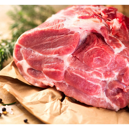 Primrose Herd Boston Butt pork joint, seasoned and ready for cooking, showing a fresh, well-trimmed pork shoulder cut.