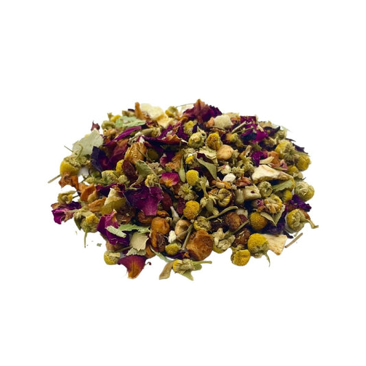 Loose leaf Peachy Chamomile tea from Camellios with dried chamomile flowers and peach pieces in a clear jar.