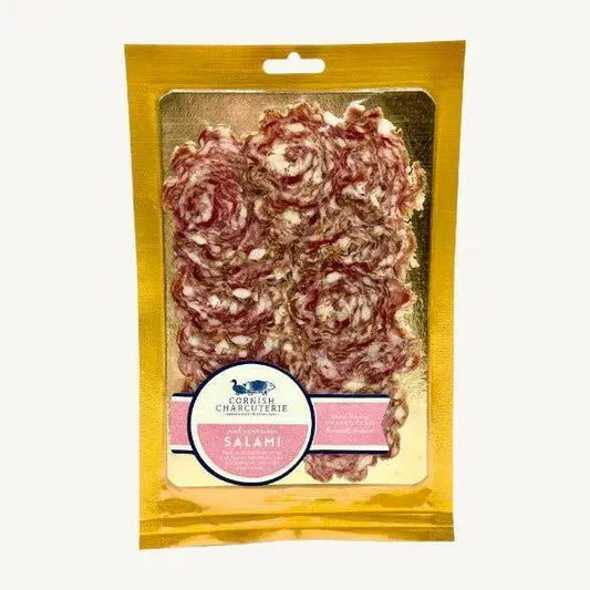 Slices of Cornish Charcuterie Pink Peppercorn Salami from ArtisanBox Selection, showcasing pink peppercorns on thinly sliced salami.