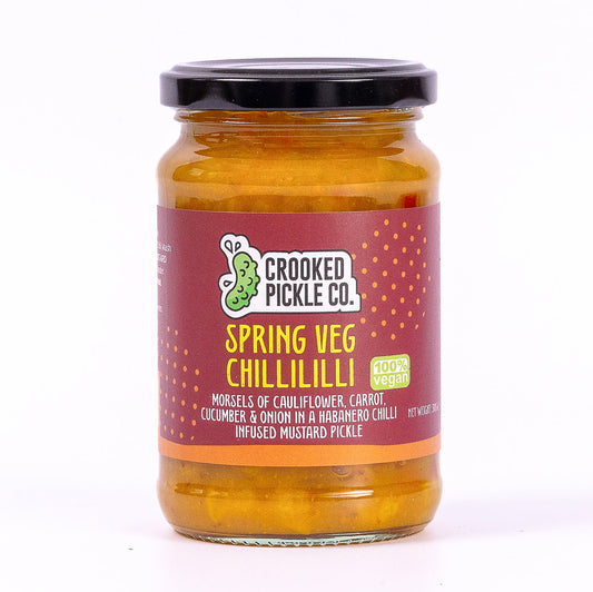 Spring Veg Chillililli by Crooked Pickle Co. fiery habanero piccalilli in a jar with vibrant vegetables and spicy peppers.