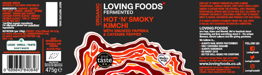 Organic Kimchi by Loving Foods, Hot 'n' Smoky flavor, showing vibrant fermented cabbage and chili flakes in a glass jar.