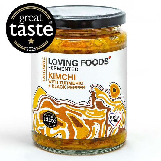 Organic Loving Foods kimchi with turmeric and black pepper in a glass jar showing fresh, colorful fermented vegetables.