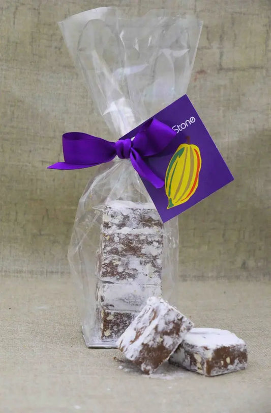 Gorvett & Stone peanut butter meltaways in a bag, showcasing smooth chocolate and creamy peanut butter filling.
