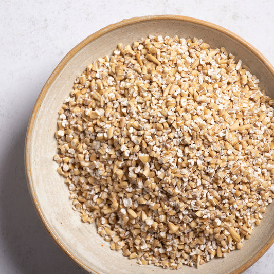 Whole Food Earth Pinhead Oatmeal Coarse Stabilised cereal in a bowl, showing the textured, rustic oat flakes.