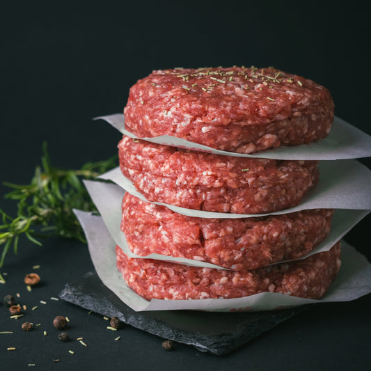 Cornish grass-fed beef burgers from Primrose Herd, 4x100g, showing fresh raw beef patties ready for cooking.