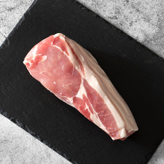 Smoked back bacon from Cornish Heritage Pork by Primrose Herd, showing thick slices of dry-cured, cured and smoked pork belly.