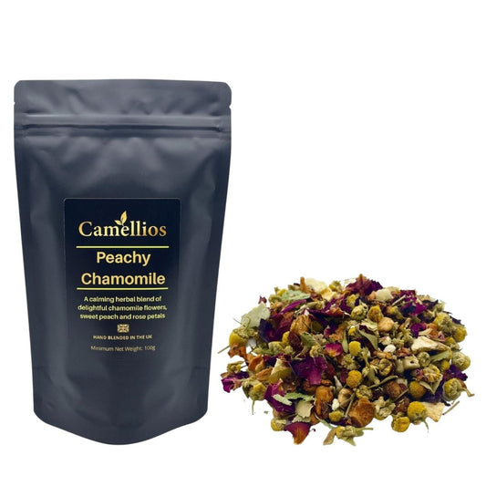 Loose leaf Peachy Chamomile tea from Camellios, displaying fresh chamomile and peach-infused herbal tea in a clear container.