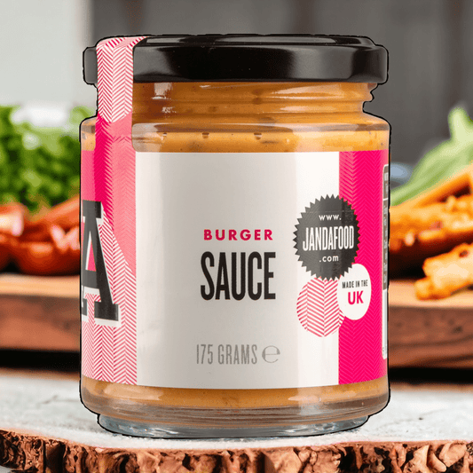 Janda burger sauce in a glass jar, creamy condiment with herbs and spices, perfect for sandwiches and burgers.