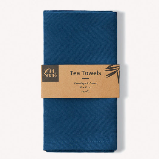 Set of two Wild and Stone organic cotton tea towels with herringbone weave, showcasing their soft texture and stylish design.