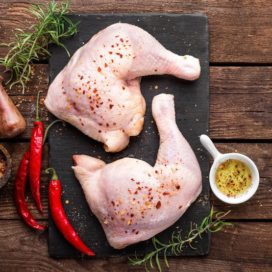 Primrose Herd Creedy Carver free-range chicken legs, raw and fresh with skin, ready for cooking or roasting.