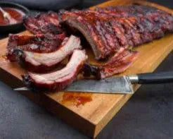 Cooked St Louis Style Pork Ribs from Primrose Herd, featuring tender, flavorful pork ribs with a smoky glaze and caramelized exterior.