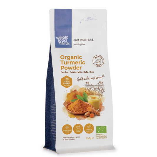 Organic turmeric powder from Whole Food Earth, highlighting bright yellow spice in a clear container for herbs and spices.
