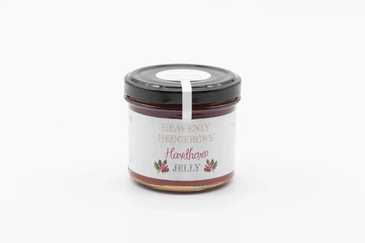 Heavenly Hedgerows Hawthorn Jelly jam jar with label and golden lid, showcasing the fruit jelly's rich color and texture.