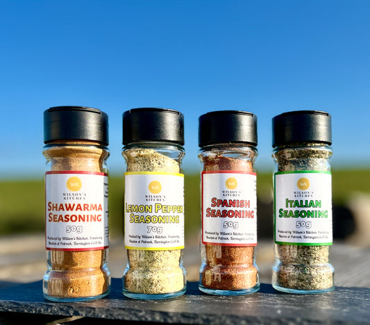 Wilson’s Kitchen Shawarma Seasoning jar, a blend of spices in a glass container, ideal for flavorful Middle Eastern dishes.