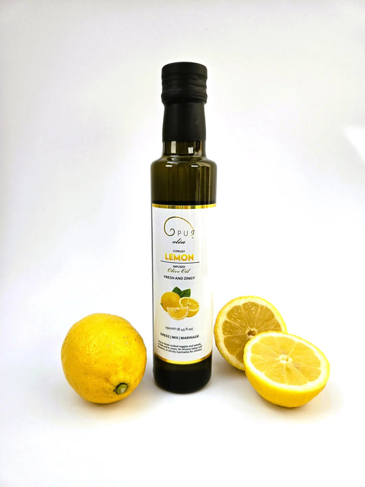 Opus Oléa Lemon Olive Oil 250ml bottle with fresh lemon and fruit on light background, highlighting natural citrus flavor.