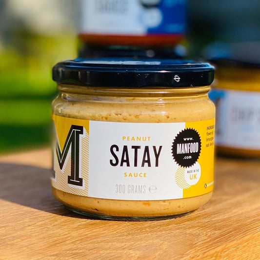 Manfood Peanut Satay Sauce in a jar, creamy and rich peanut sauce for dipping or cooking, natural ingredients shown in the image.
