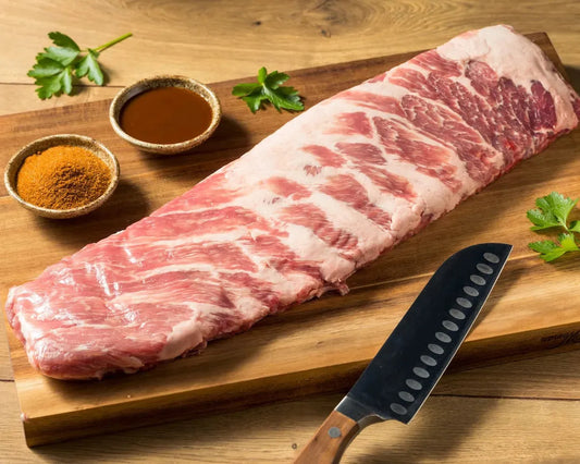 Raw St Louis Style Pork Ribs from Primrose Herd, showcasing meaty, well-trimmed pork ribs ready for cooking