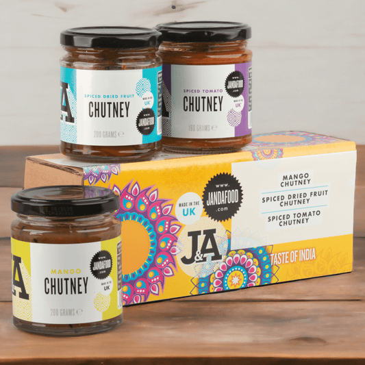 Janda Taste of India gift box with assorted Indian snacks and spices, presented in a decorative gift packaging.