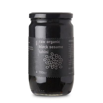 Raw Organic Black Sesame Tahini spread from Whole Food Earth, showcasing a thick, creamy black sesame paste in a jar.
