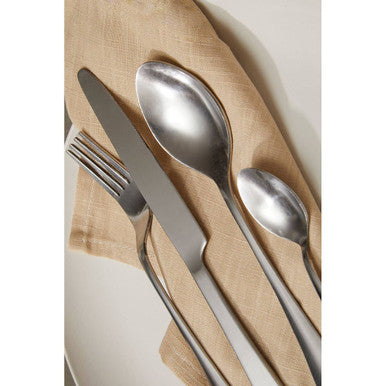 Orsina Gracy 16-piece cutlery set with stainless steel forks, knives, spoons, and serving utensils arranged on a table.