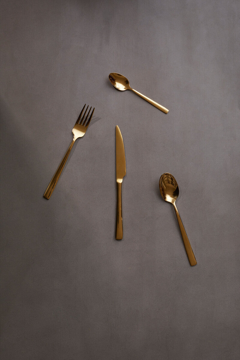 Orsina Glow 16-piece gold cutlery set with sleek forks, knives, and spoons arranged on a white background.
