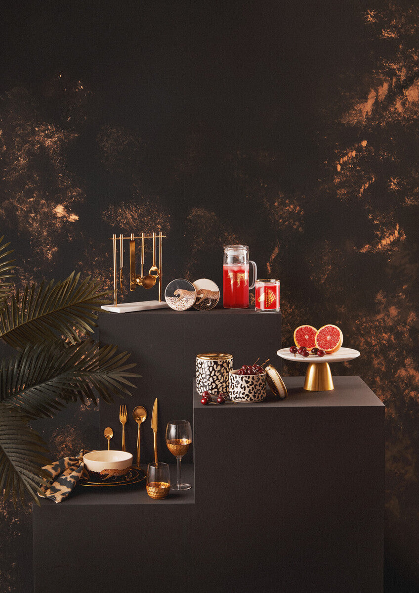 Orsina Glow 16-piece gold cutlery set featuring sleek forks, knives, and spoons with a shiny gold finish.