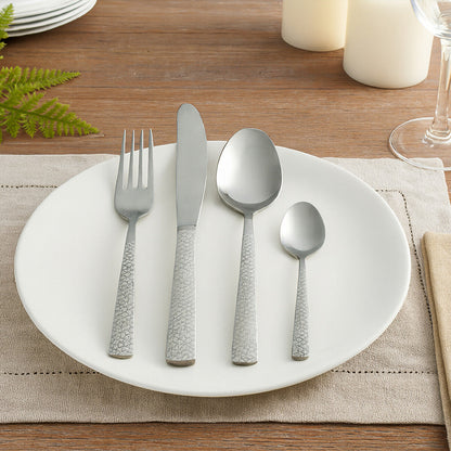 Casablanca 16-piece stainless steel cutlery set by Orsina with forks, knives, spoons arranged on a white background.