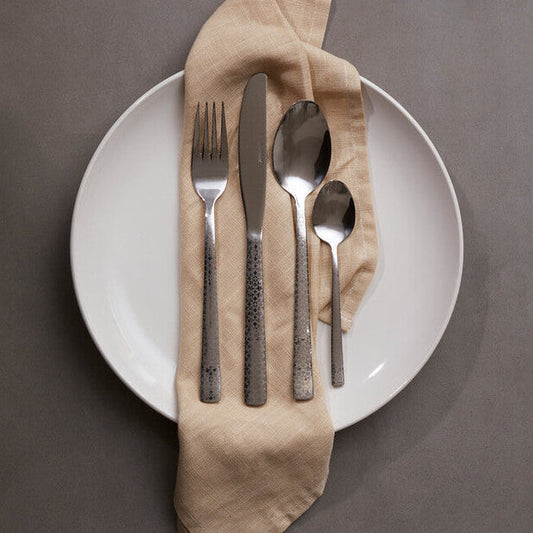 Casablanca 24-piece cutlery set by Orsina featuring stainless steel forks, knives, and spoons arranged neatly on a table.