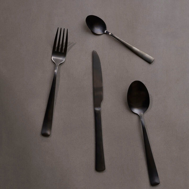 Onyx 16-piece cutlery set by Orsina featuring sleek knives, forks, and spoons with polished stainless steel handles.