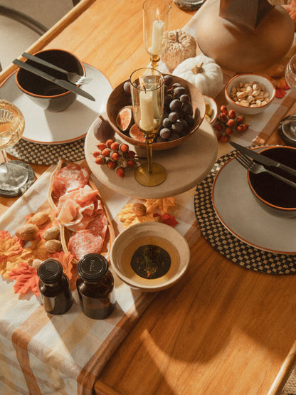Orsina 16-piece onyx cutlery set including knives, forks, and spoons arranged on a dining table.