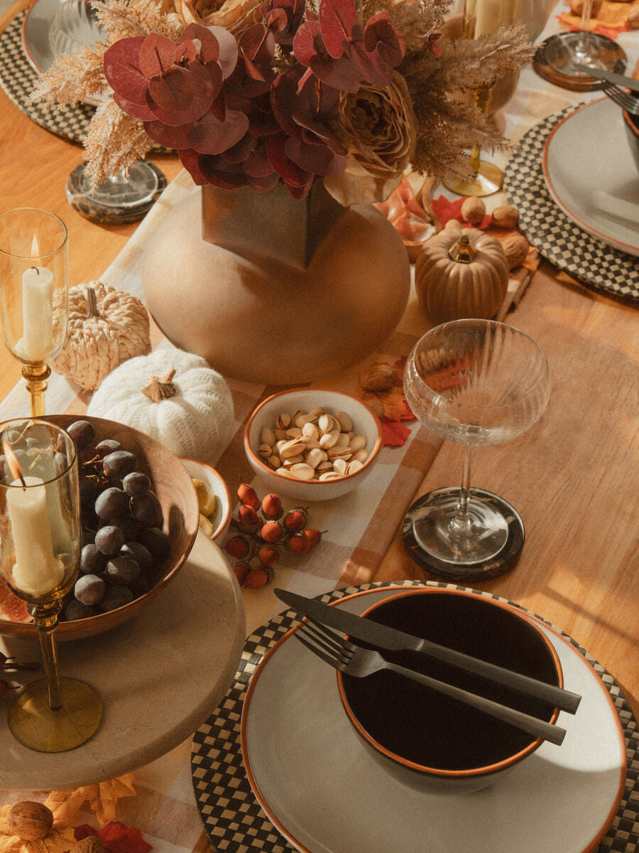 Orsina 16-piece onyx cutlery set including knives, forks, and spoons arranged on a dining table for elegant tableware.