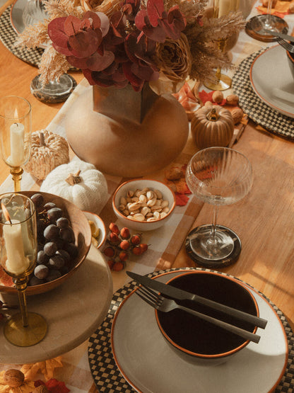 Orsina 16-piece onyx cutlery set including knives, forks, and spoons arranged on a dining table for elegant tableware.
