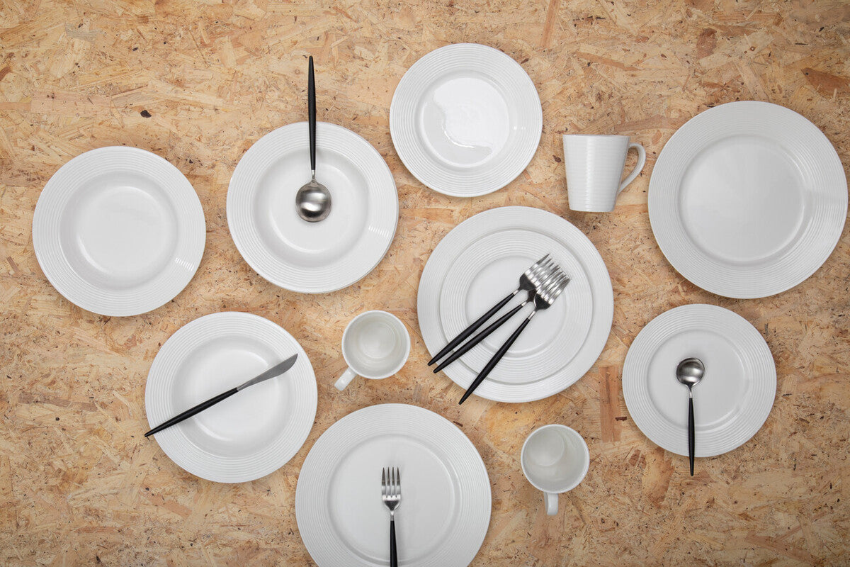 16-piece matte silver and black cutlery set by Orsina, featuring sleek knives, forks, and spoons for modern table setting.