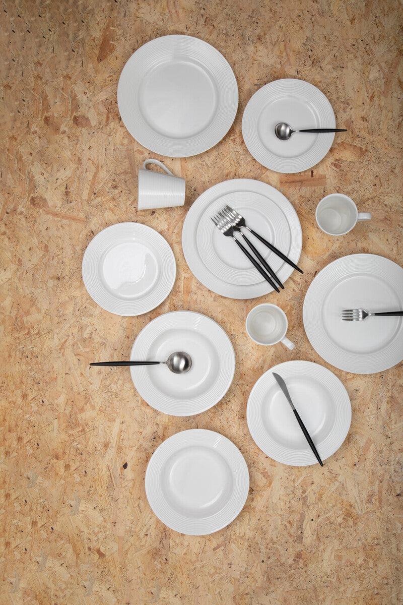 Orsina 16-piece matte silver and black cutlery set with forks, knives, and spoons arranged on a table.