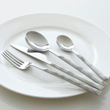 Orsina 16-piece white faux marble cutlery set with sleek spoons, forks, and knives for modern table settings.