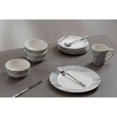 Orsina 16-piece white faux marble cutlery set including forks, knives, and spoons arranged on a table.