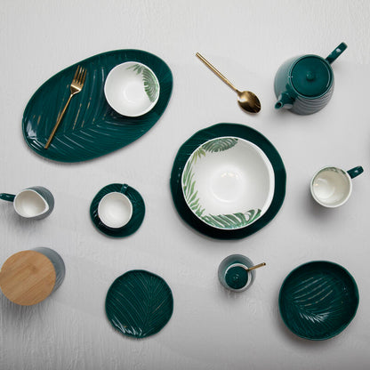 Orsina 16-piece gold finish modern retro cutlery set with forks, knives, and spoons arranged on a wooden table.