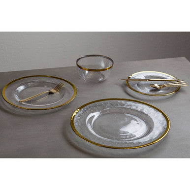 16-piece gold finish modern retro cutlery set by Orsina, including forks, knives, spoons, and serving utensils on a table.