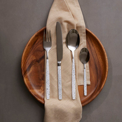 Orsina 16-piece granite pattern cutlery set with stainless steel forks, knives, and spoons arranged on a table.