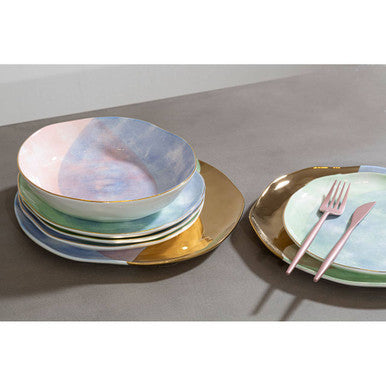 16-piece matte pink finish Orsina cutlery set including forks, knives, spoons, and teaspoons arranged on a neutral surface.