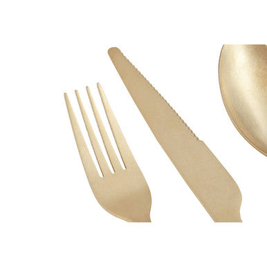 16-piece antique gold Orsina cutlery set with forks, knives, and spoons arranged on a table with a floral background.
