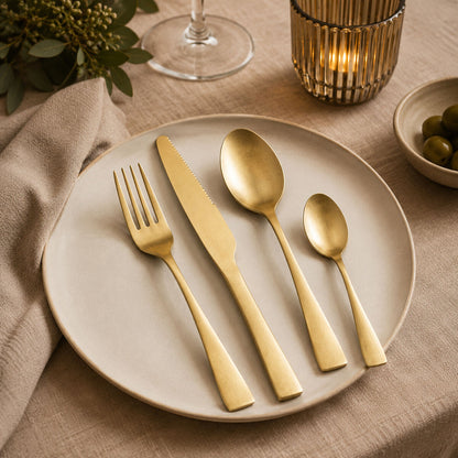 Orsina 16-piece antique gold cutlery set featuring forks, knives, and spoons arranged on a wooden surface.