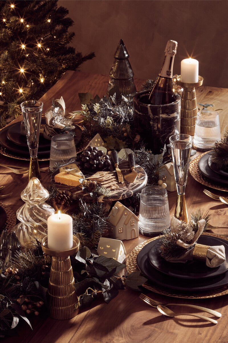 Orsina 16-piece antique gold finish cutlery set, including forks, knives, and spoons arranged on a table.