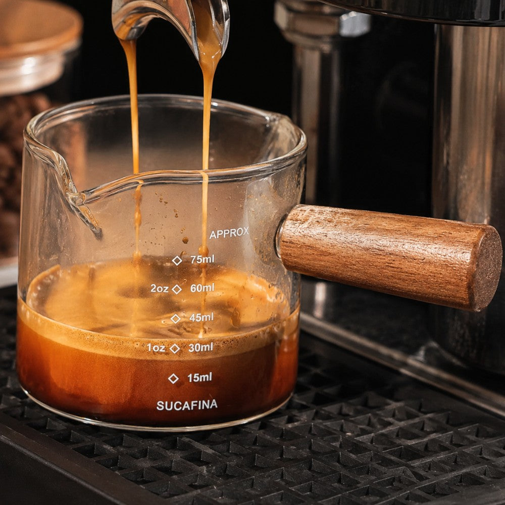 KNOCDIC® 100ml glass espresso measuring cup with wooden handle for precise brewing and coffee measurements.
