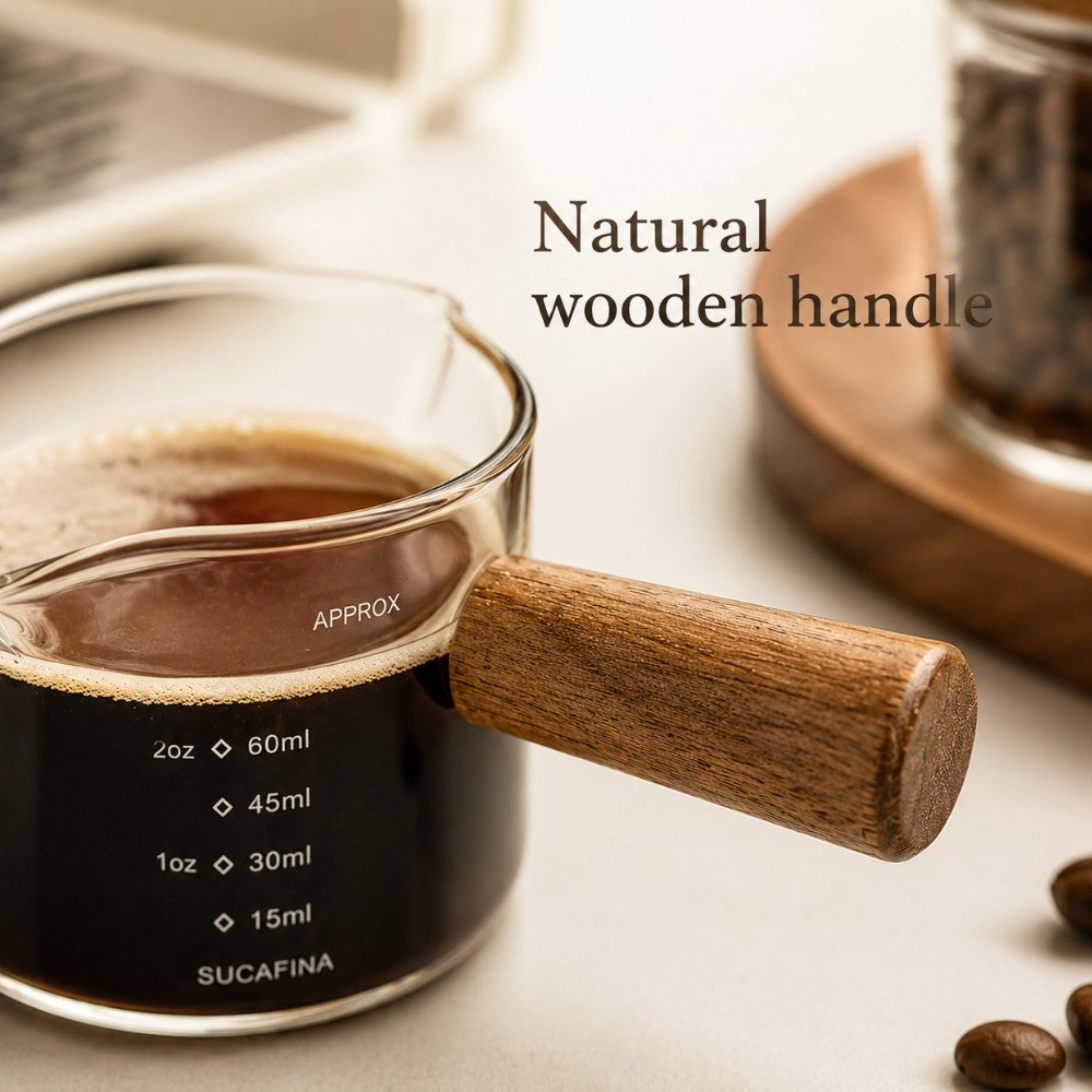 KNOCDIC® 100ml glass espresso measuring cup with a wooden handle for precise coffee measurements.